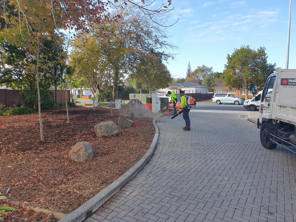 Holland Landscaping crew bark installation and tidy-up at an Auckland aged-care facility