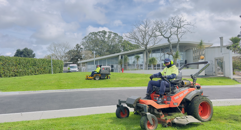 Holland Landscaping crew performing ongoing lawn maintenance