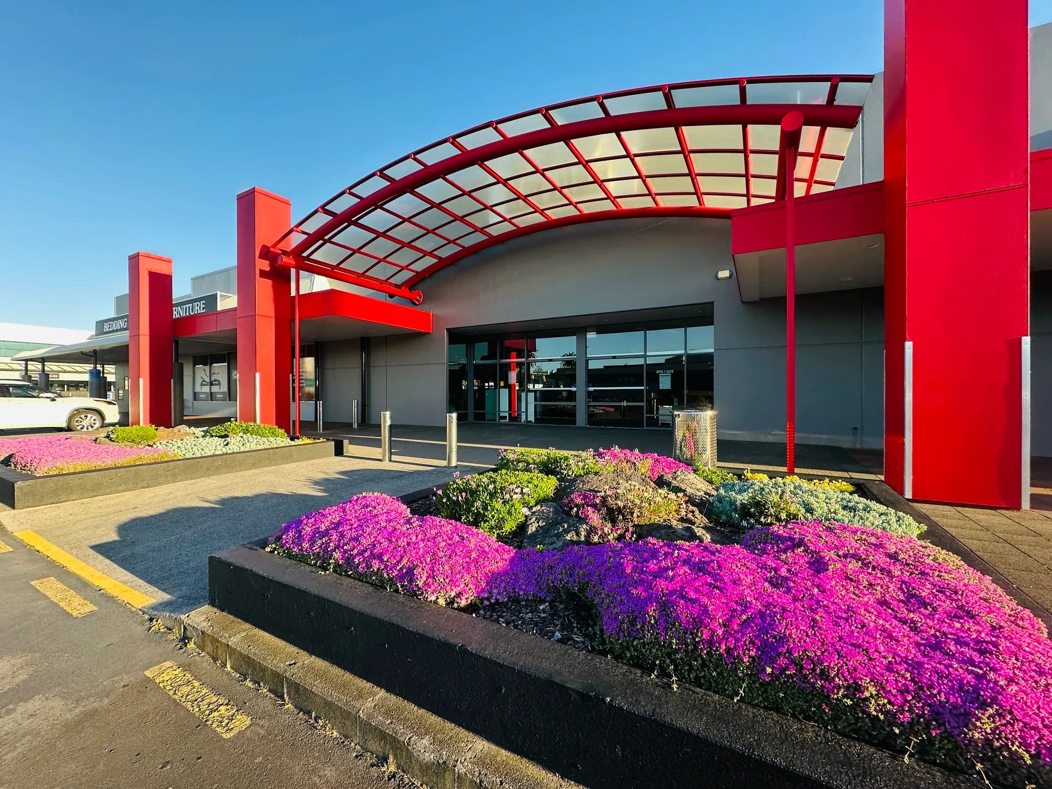 Finished commercial retail entrance landscape built by Holland Landscaping in Auckland