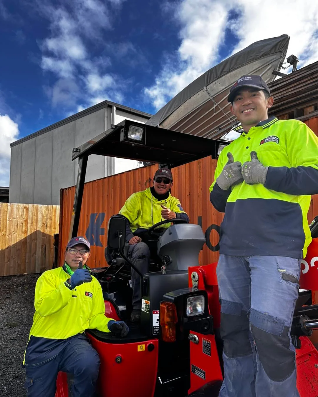 Holland crew members giving thumbs up on site