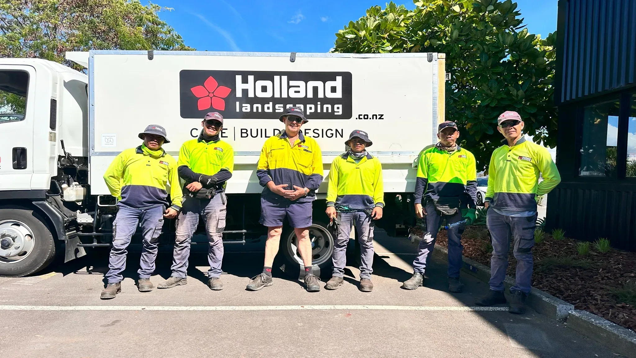 Holland Landscaping crew with truck at an Auckland business park